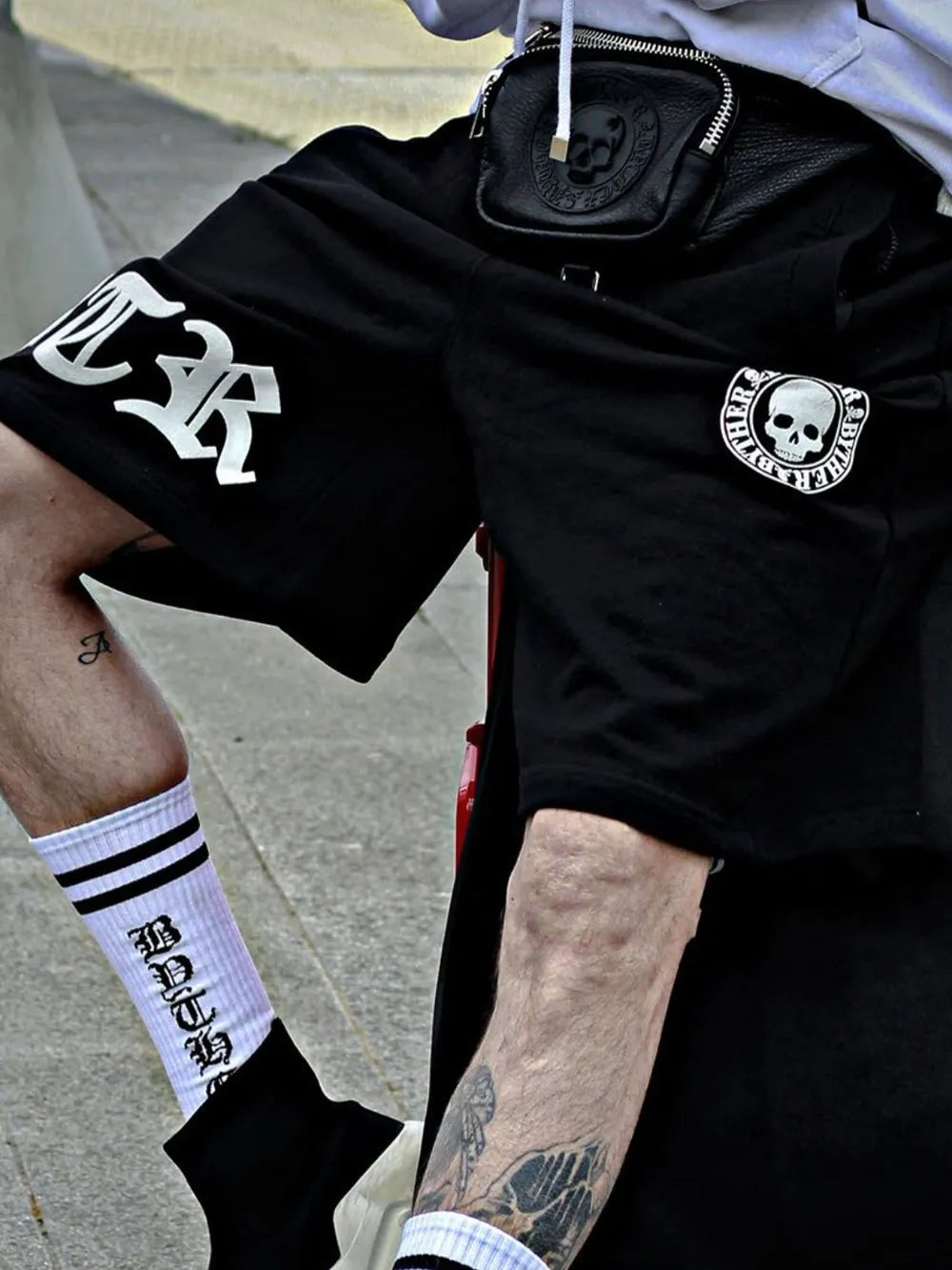Men's plus size elastic waist shorts in black with skull design, streetwear style.