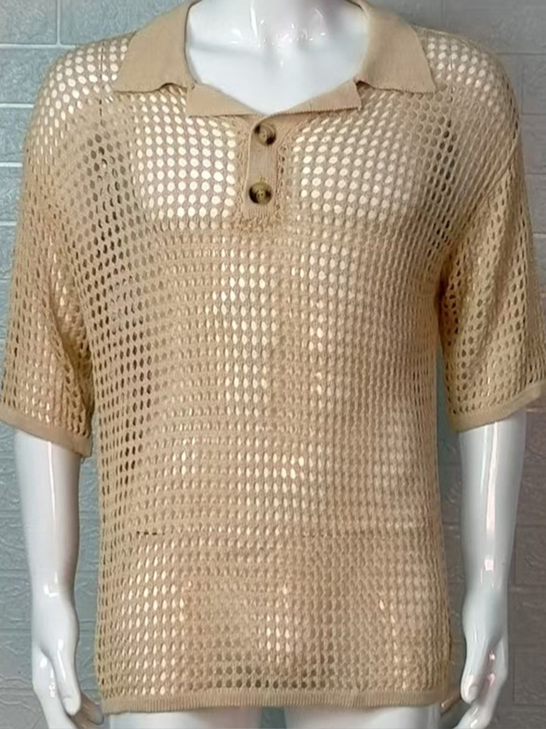 Men's plus size openwork knit polo with collared neck and quarter button design.