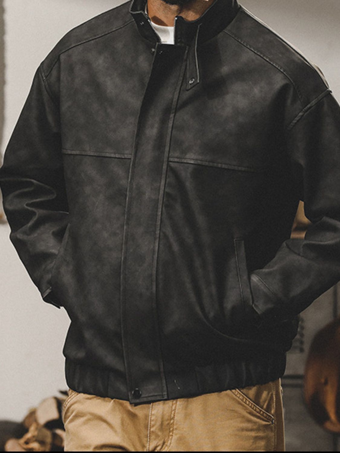 Men's plus size black zip-up biker jacket with stand collar.