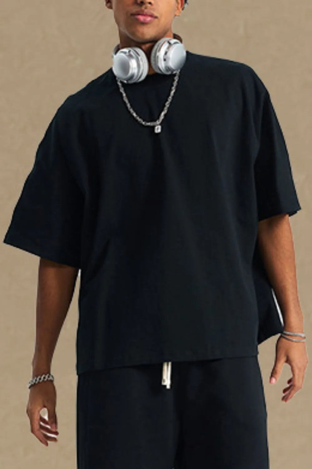 Men's black round neck half sleeve T-shirt made from 100% cotton.