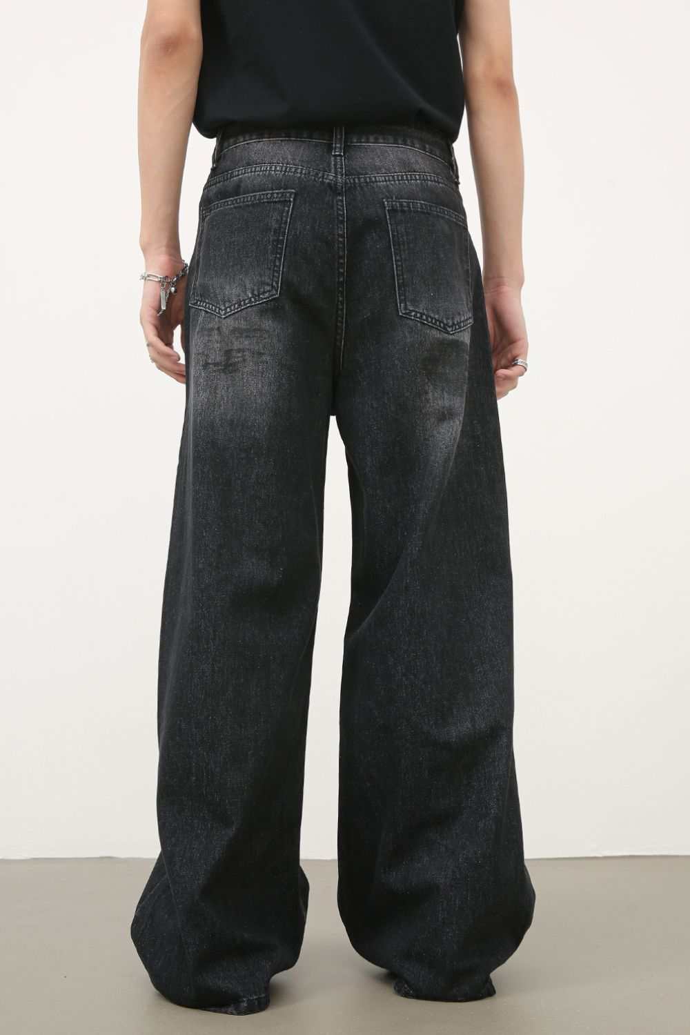 Men's Cat's Whisker wide leg jeans in dark wash, back view.
