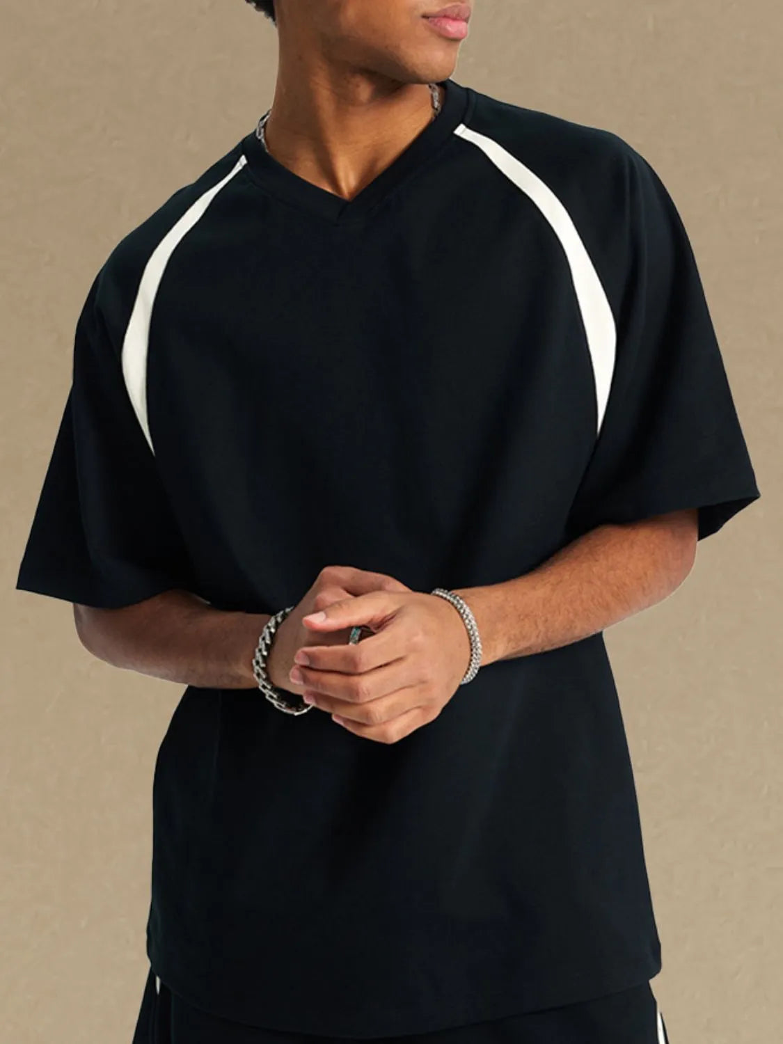 Men's contrast round neck half sleeve t-shirt, slightly stretchy, black with white accents.