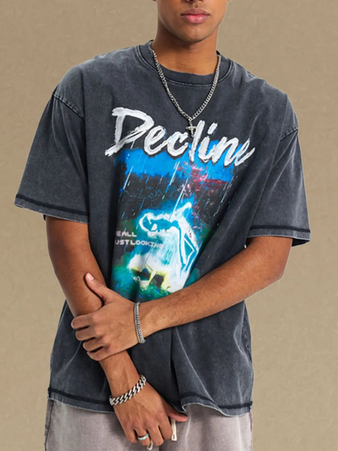 Men's graphic round neck half sleeve t-shirt in cotton with a colorful design.