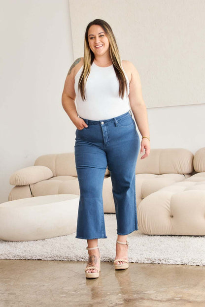 Tummy Control High Waist Raw Hem Jeans on woman in casual setting, flattering fit, moderate stretch.
