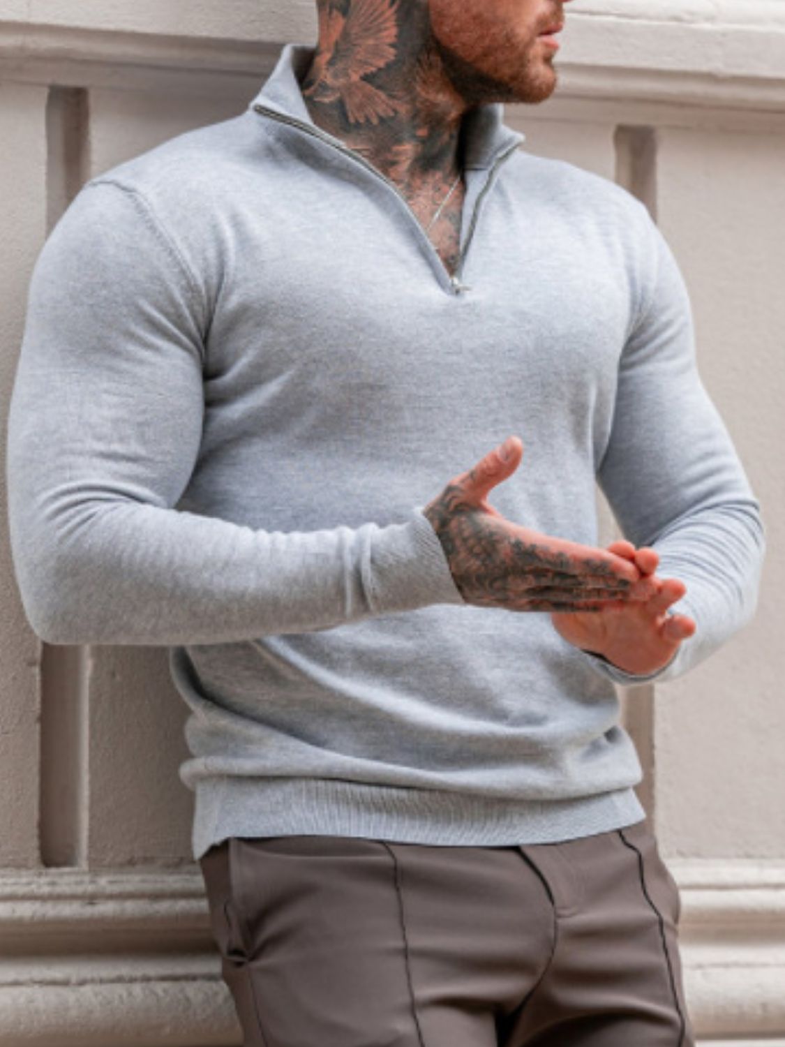 Men's plus size quarter zip long sleeve knit top with moderate stretch.