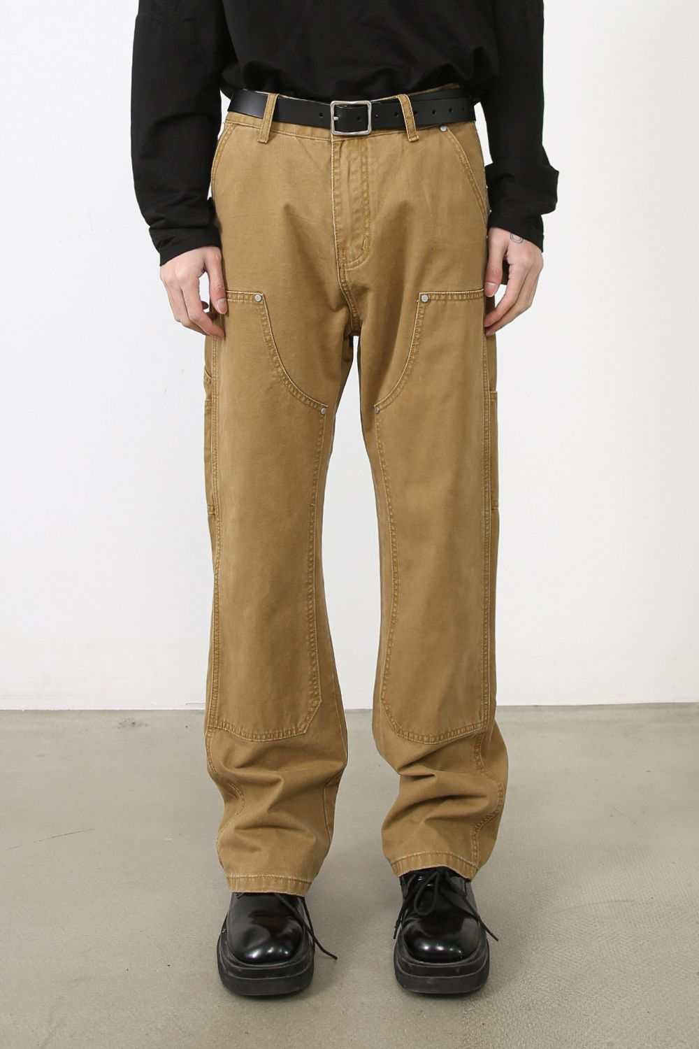 Men's brown wide straight leg jeans with pockets, no stretch, 100% cotton.