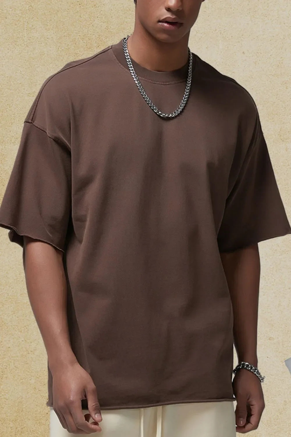 Men's round neck half sleeve t-shirt in brown, slightly stretchy cotton fabric.