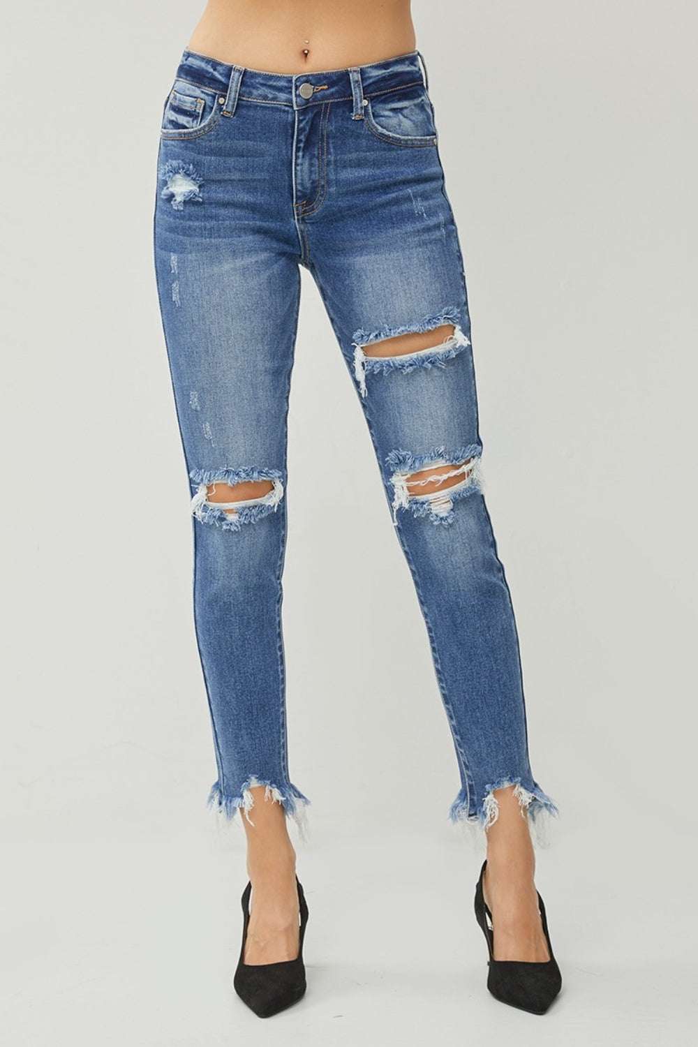 RISEN Distressed Frayed Hem Slim Jeans with ripped detailing and raw hem.