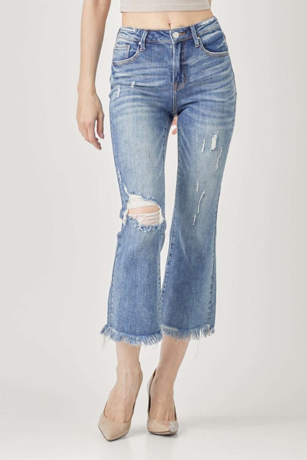 High Waist Distressed Cropped Bootcut Jeans with raw hem and edginess.