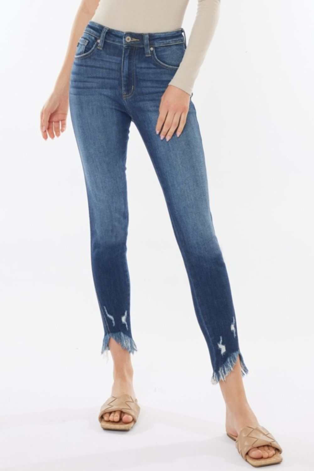 Raw hem high waist cropped jeans with a trendy and edgy look.