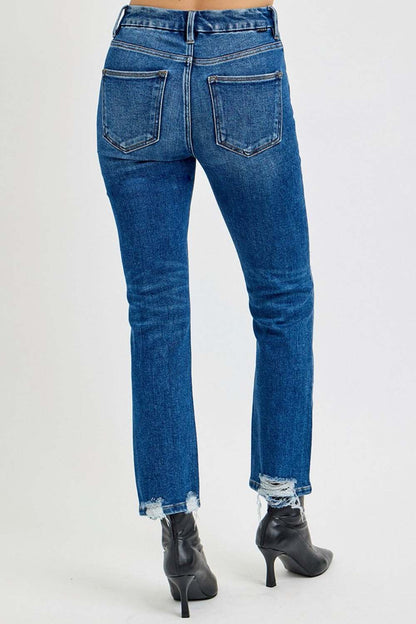 High rise distressed crop straight jeans with raw hem, back pocket detail, and paired with ankle boots.