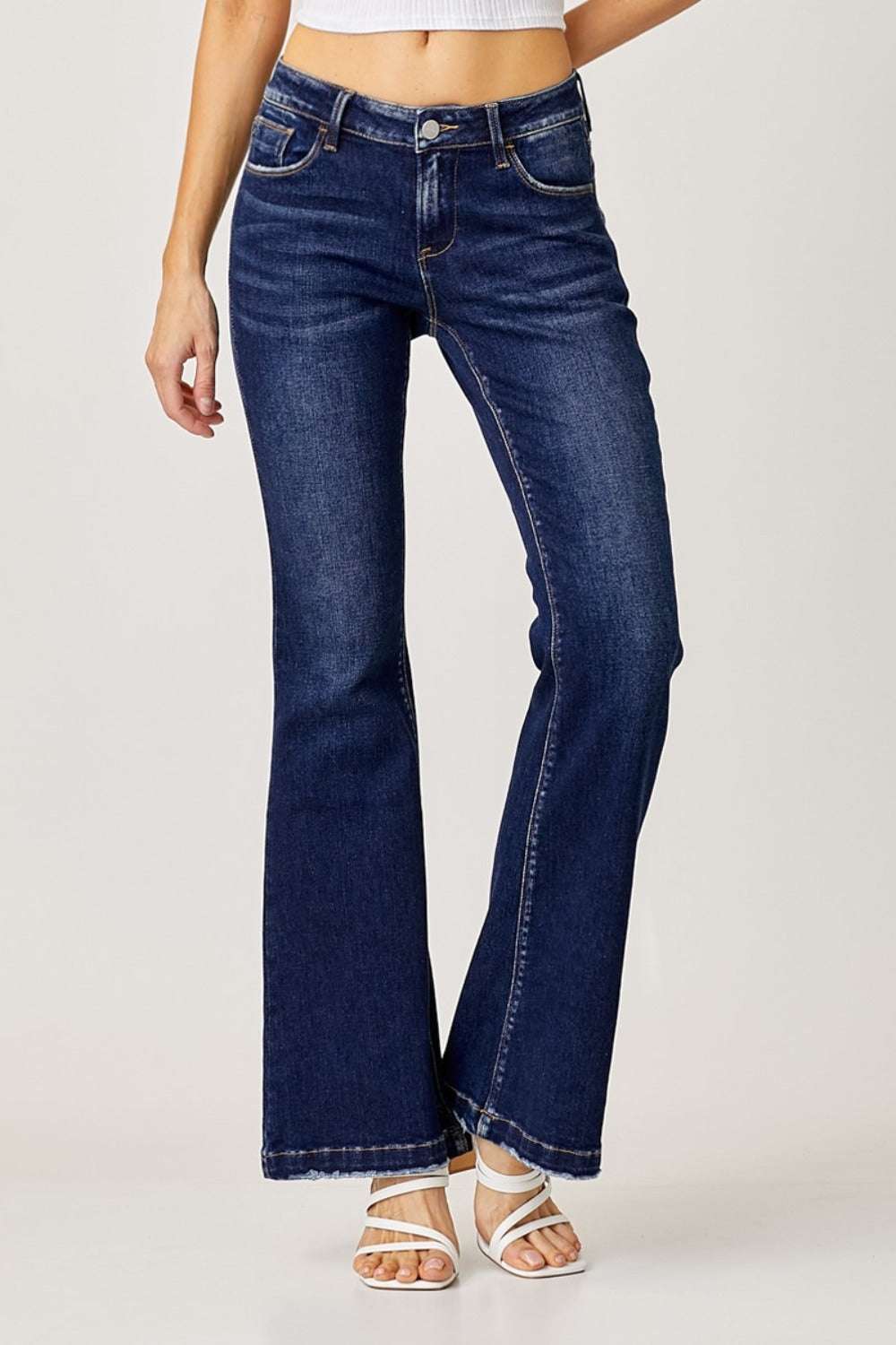 Full size low rise flare jeans with dark wash and pocket detail.