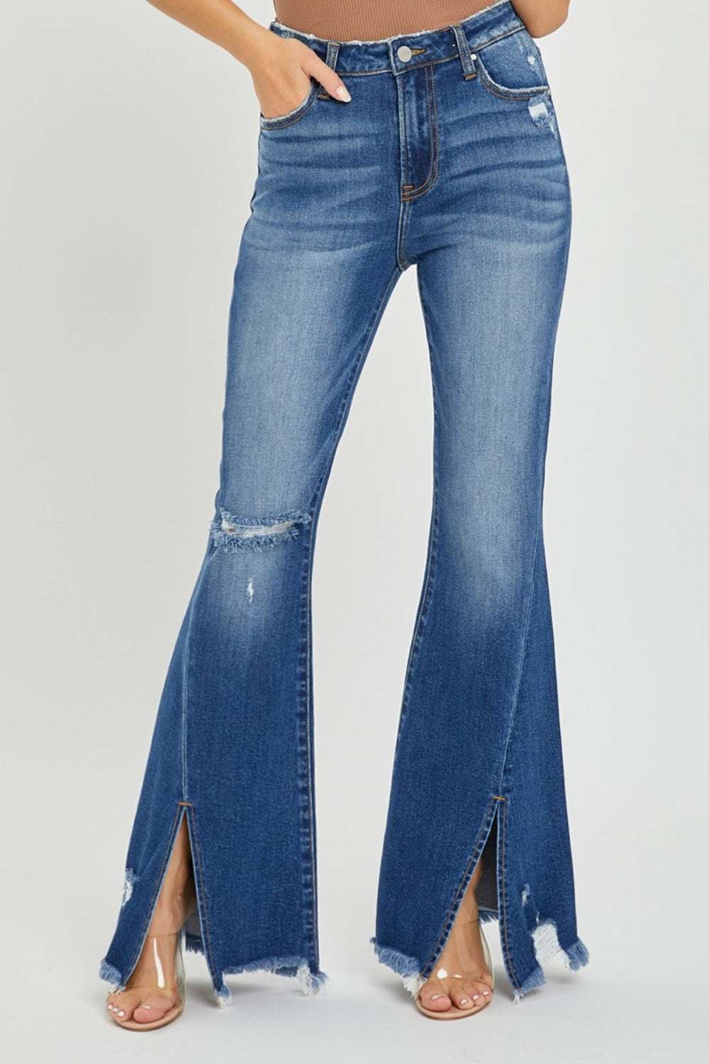 Full size high rise flare jeans with front slit and frayed hem.