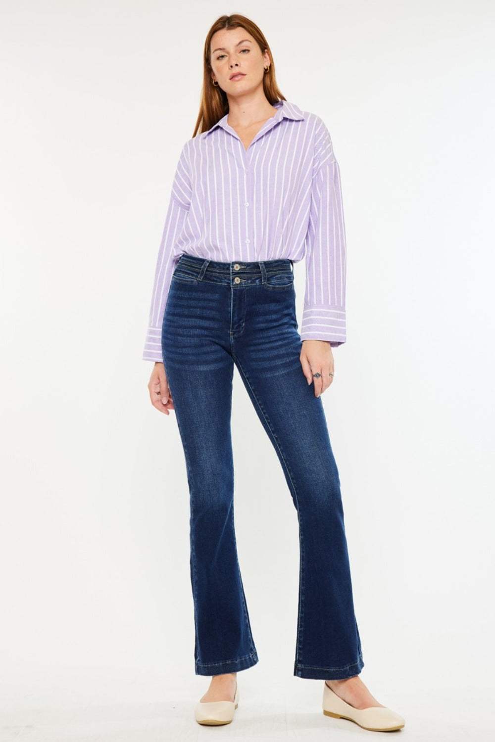 High-rise double waistband flare jeans in dark wash with welt pocket style.