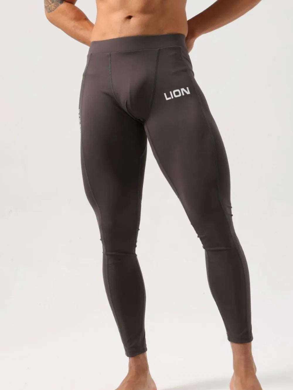 Men's high waist active leggings, stretchy nylon-spandex blend.