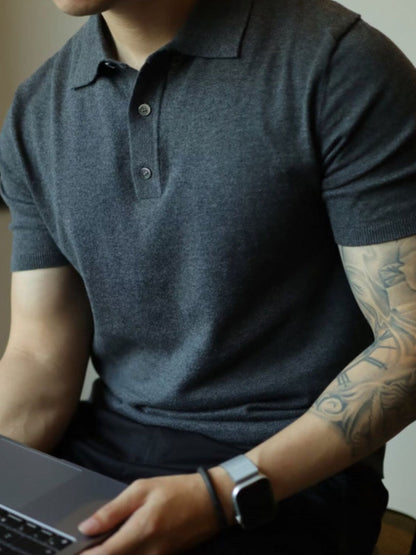 Men's plus size short sleeve polo with button detail in dark color, slightly stretchy material.
