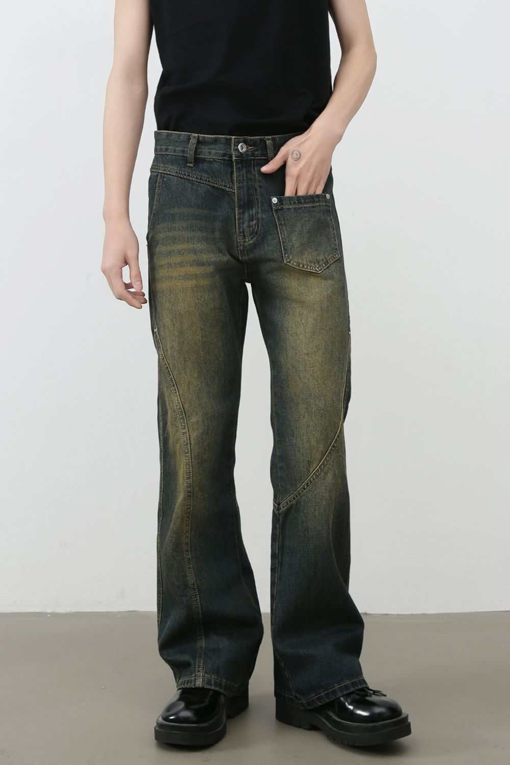 Men's mid rise bootcut jeans in dark wash, showcasing basic style with no stretch. Made from a cotton blend for comfort.