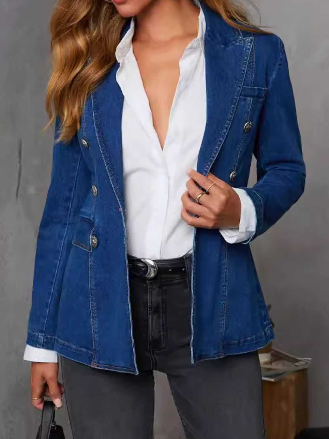 Collared neck long sleeve denim jacket with button closure.