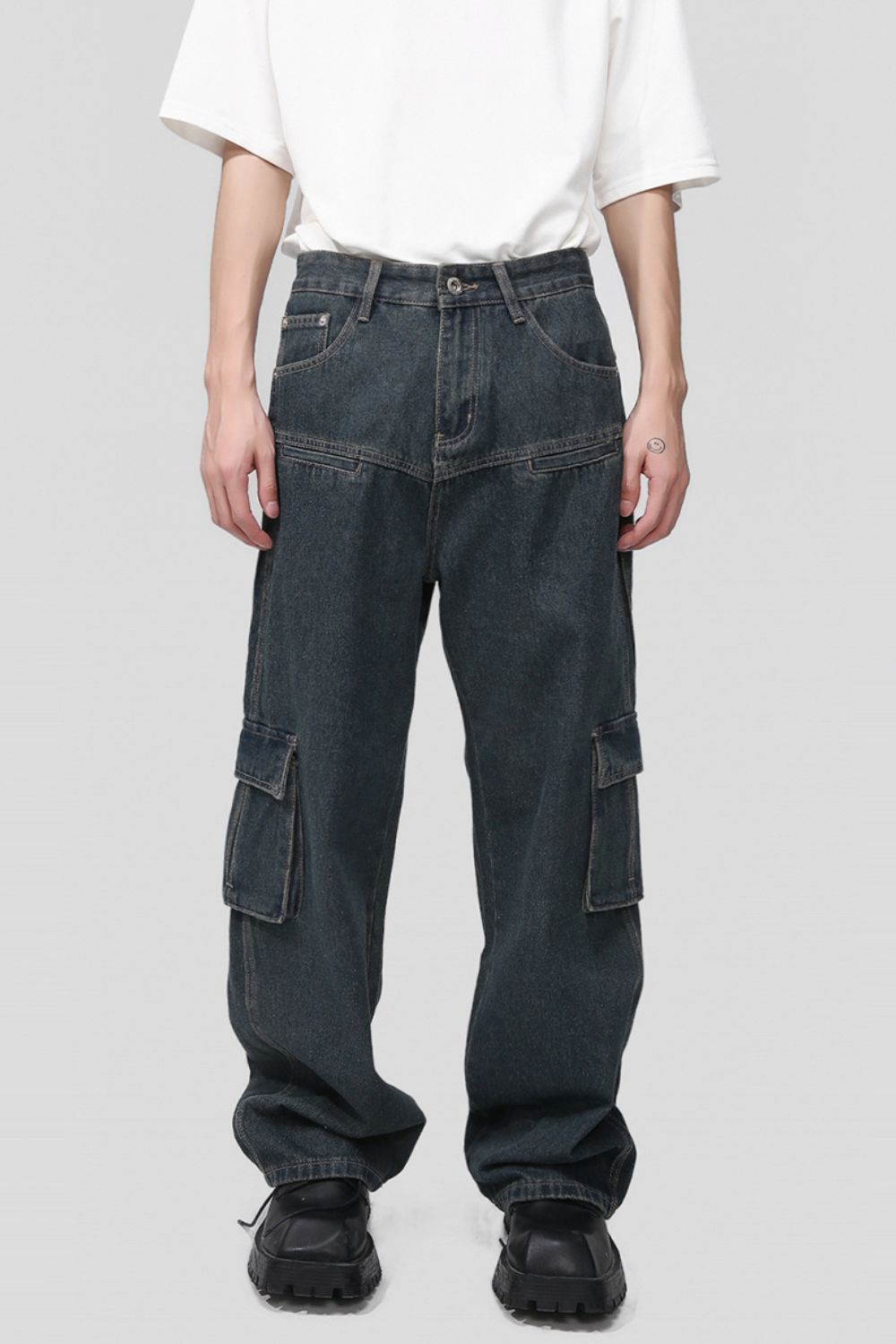 Men's multi pocketed cargo jeans in dark denim with no stretch.