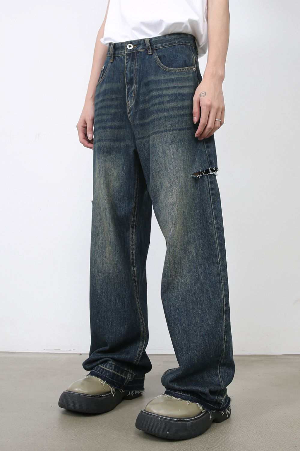 Men's raw hem distressed jeans with pockets, no stretch, cotton blend.