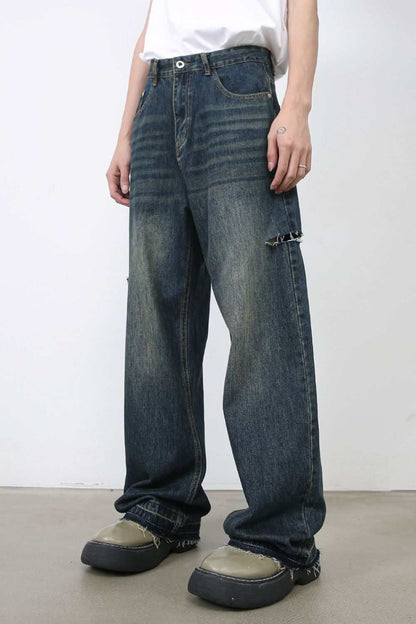 Men's raw hem distressed jeans with pockets, no stretch, cotton blend.