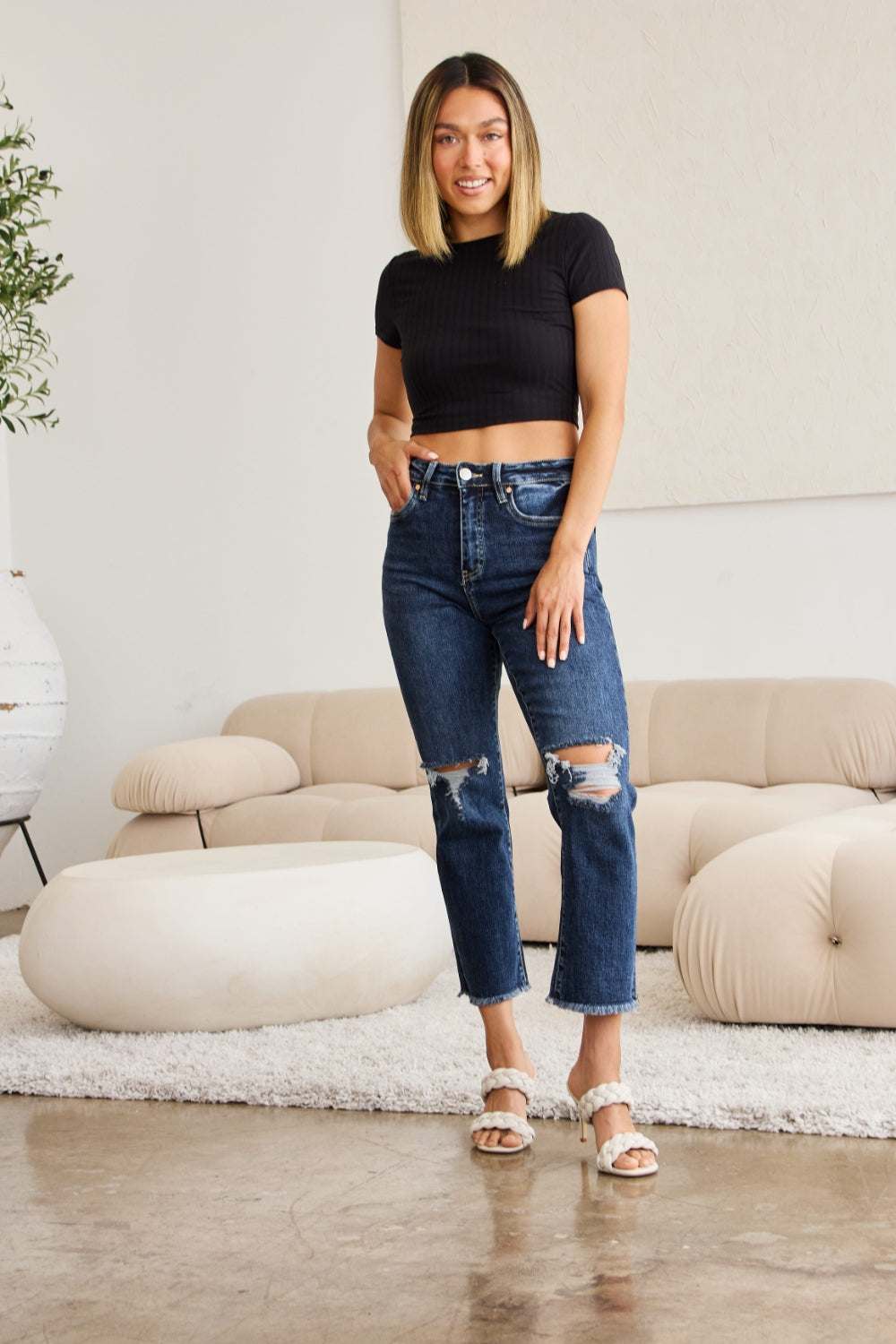 Tummy Control Distressed High Waist Raw Hem Jeans with black top and sandals.