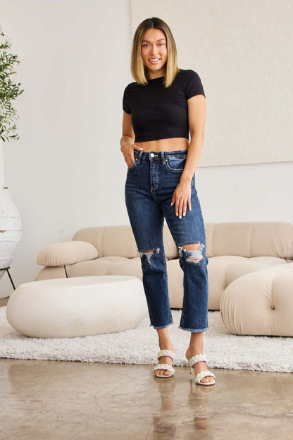 Tummy Control Distressed High Waist Raw Hem Jeans with black top and sandals.
