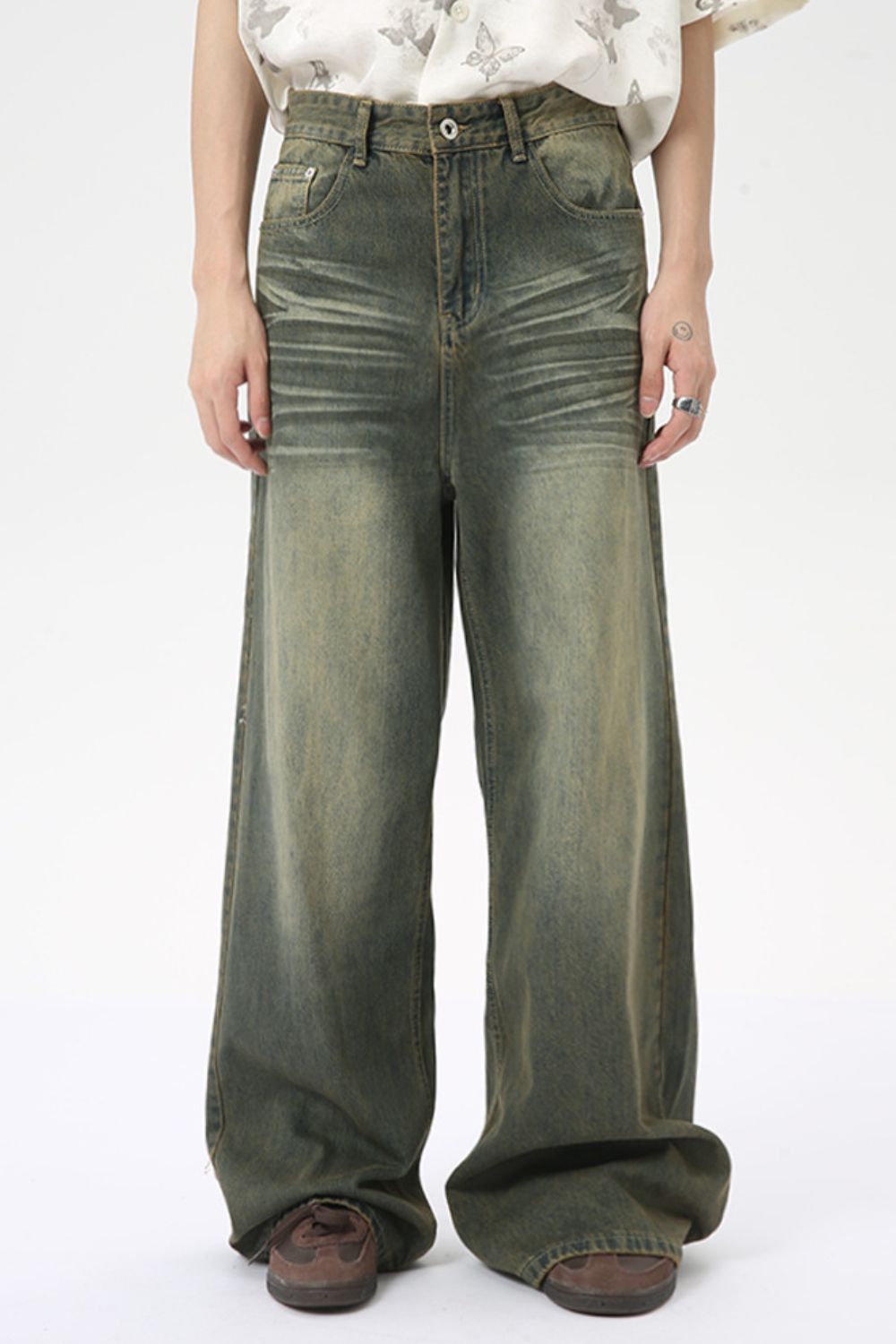 Wide leg jeans with pockets made from cotton blend, shown in a casual style.
