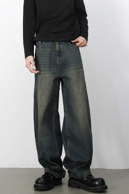 Men's wide leg jeans in dark wash denim.