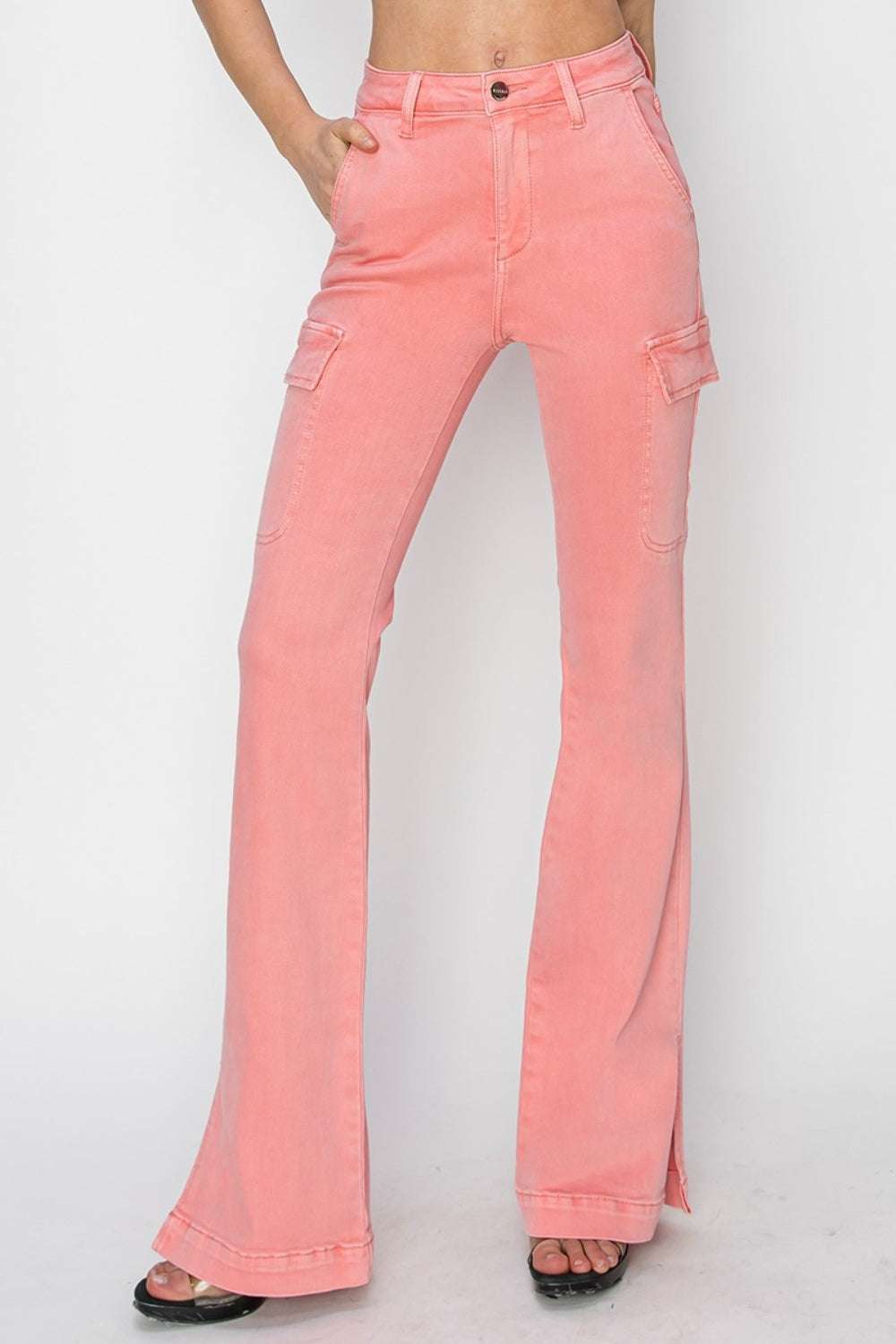 Full size high rise side slit cargo bootcut jeans in pink with pockets.