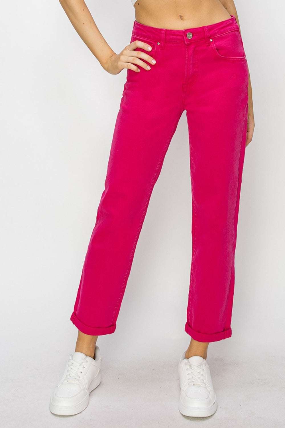 High waist rolled hem straight jeans in vibrant pink, paired with white sneakers.