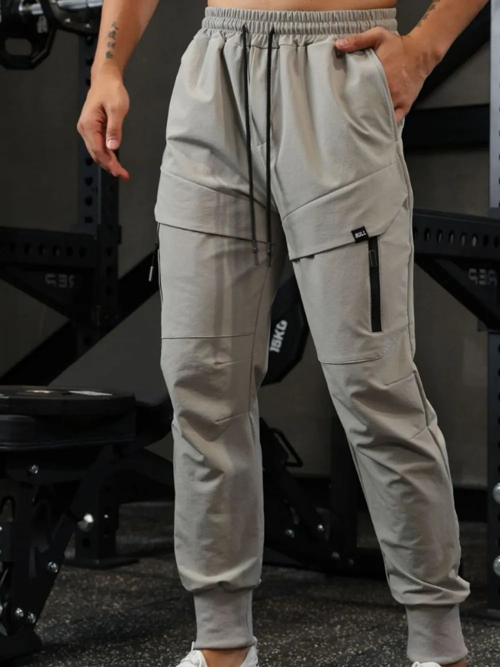 Men's drawstring joggers with pockets, nylon polyester blend, basic style.