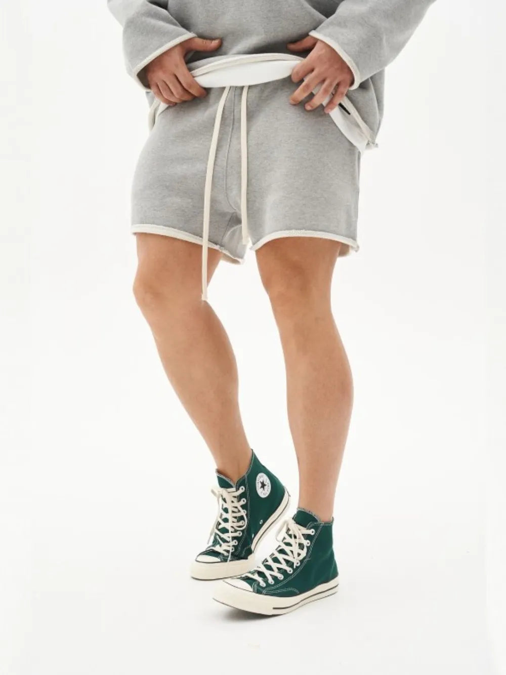 Men's plus size drawstring shorts in gray, shown worn with green high-top sneakers.