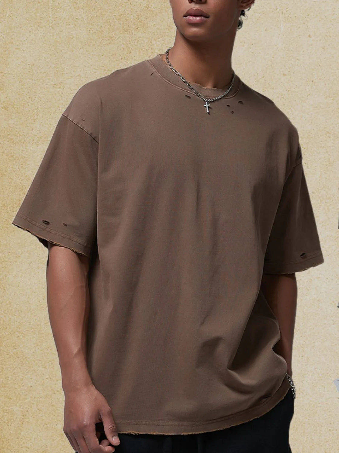 Men's round neck half sleeve distressed t-shirt in brown.