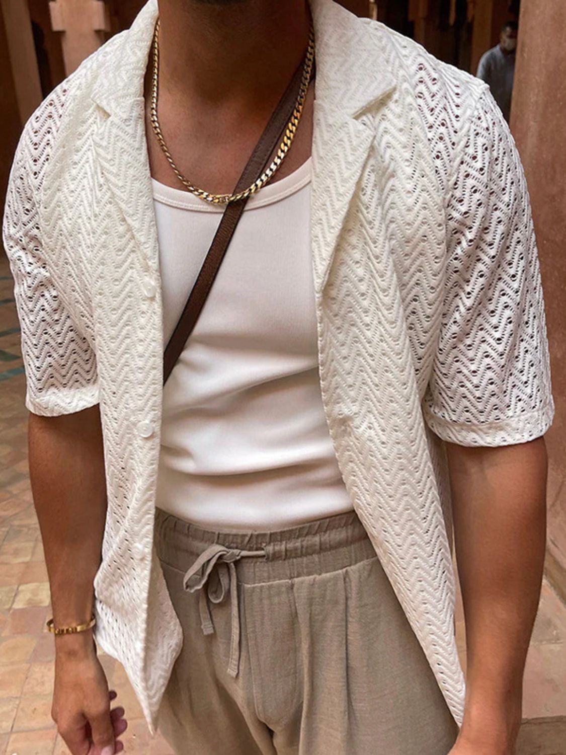 Men's plus size herringbone eyelet button-down knit shirt in off-white, featuring short sleeves and a slightly stretchy fabric.