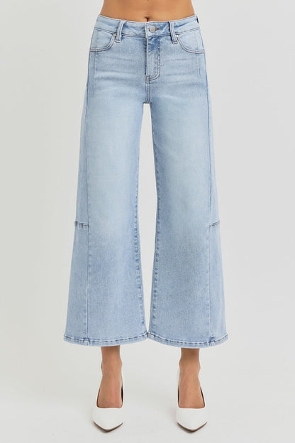 Wide leg crop jeans with high rise and seamed details in light blue denim.