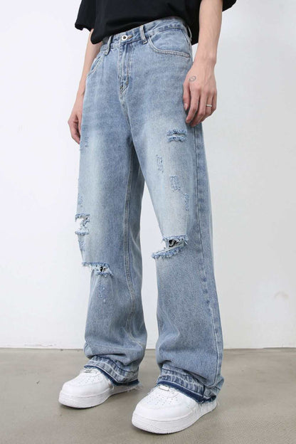 Men's distressed baggy jeans with raw hem, no stretch, cotton blend.