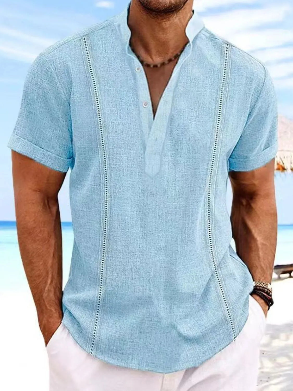 Men's full-size button detail short sleeve shirt, slightly stretchy cotton blend, beach background.