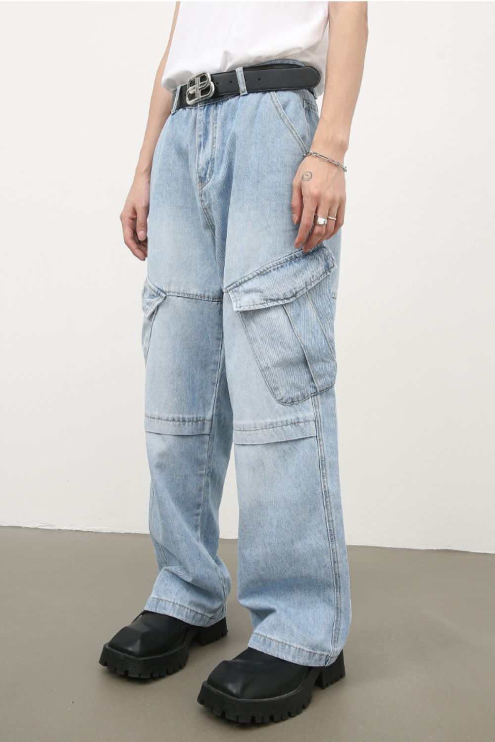 Men's mid rise jeans with cargo pockets, light wash, cotton blend, casual style.