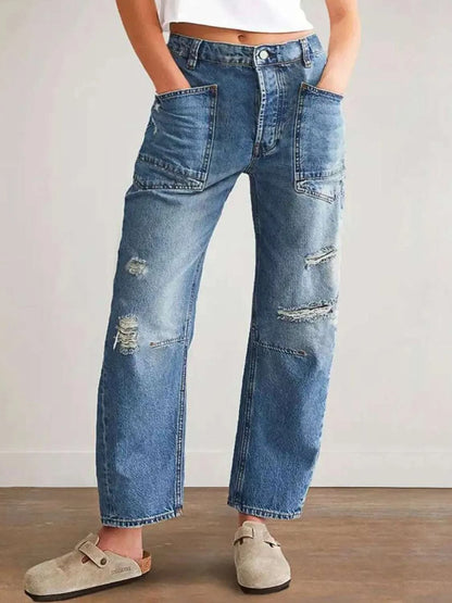 Distressed blue jeans with pockets, no stretch, cotton-polyester blend.