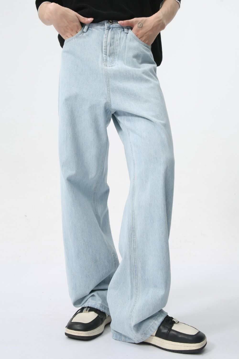 Wide leg jeans with pockets, light wash, basic style, no stretch.