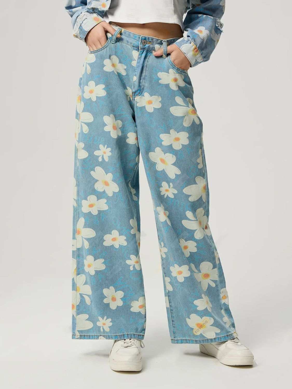 Pocketed floral wide leg jeans with buttoned design and no stretch in blue.