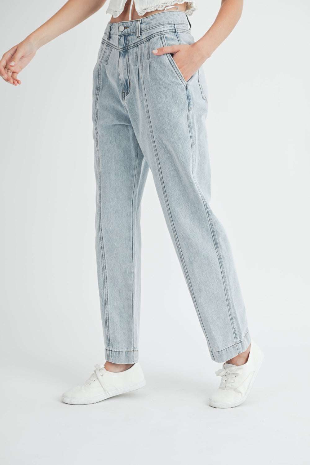 Pleated front detail straight jeans with chic design, moderate stretch, and pocketed style.