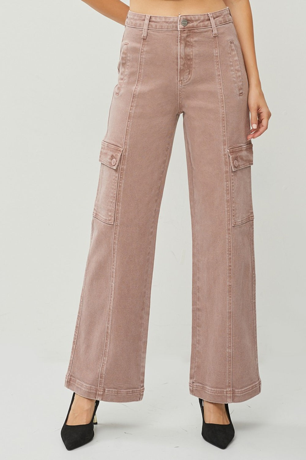 High rise wide leg cargo jeans with pockets, shown in neutral color, styled with black heels.