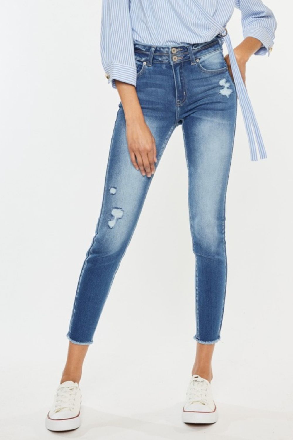 Kancan Distressed Raw Hem High Waist Jeans with rugged detailing and modern raw hems.