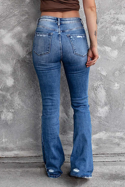 Distressed bootcut jeans with sequin bow detail and slight stretch.
