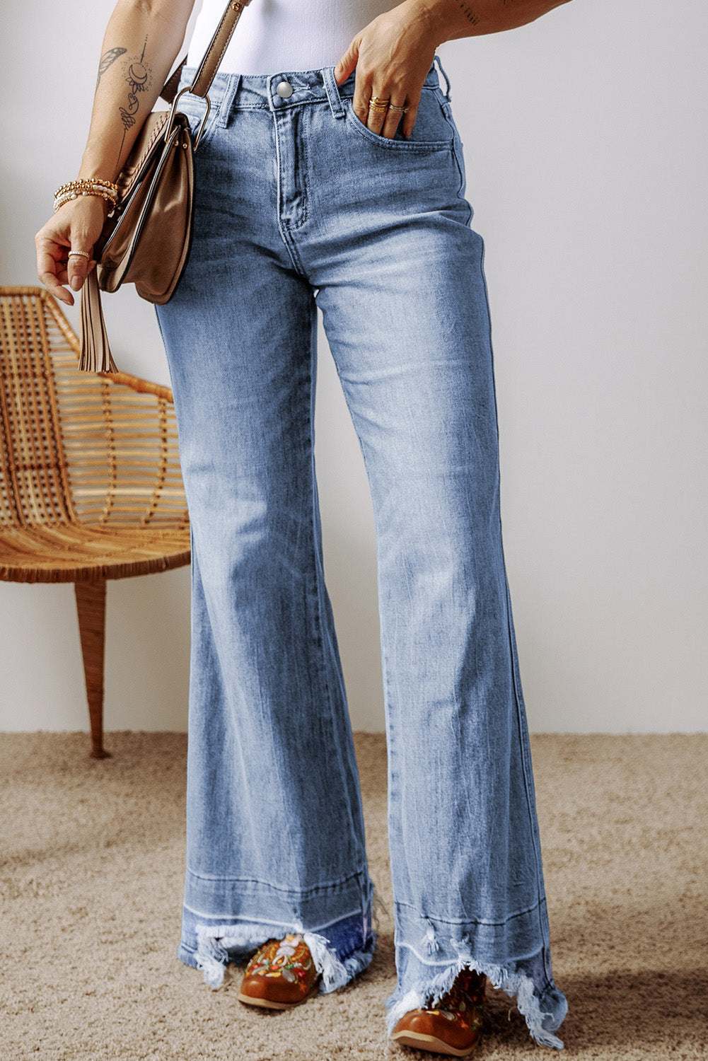 Raw hem bootcut jeans with pockets, lightly stretchy denim.