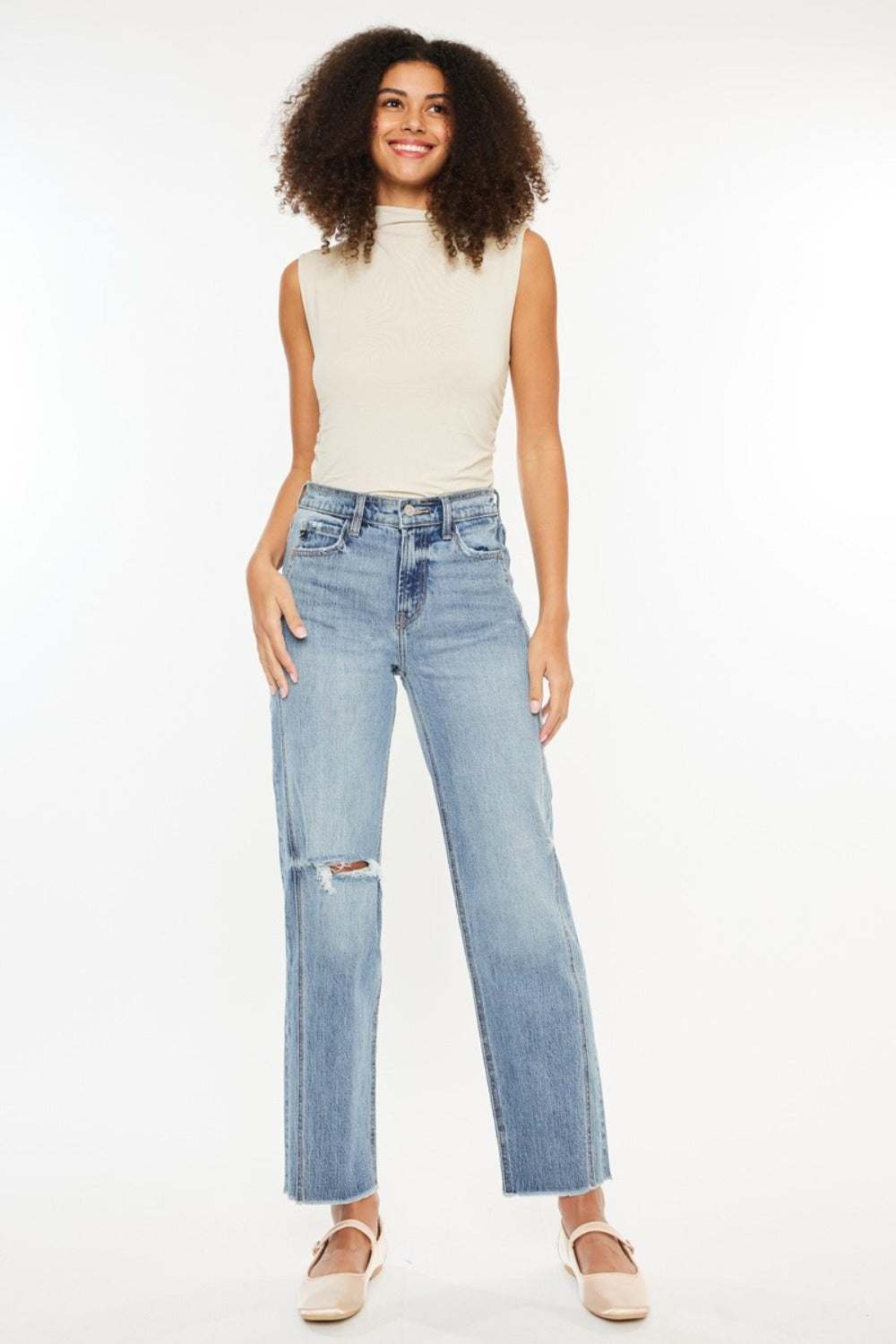 Ultra high-rise distressed straight jeans in medium stone wash.