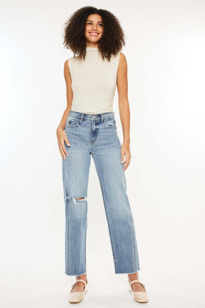 Ultra high-rise distressed straight jeans in medium stone wash.
