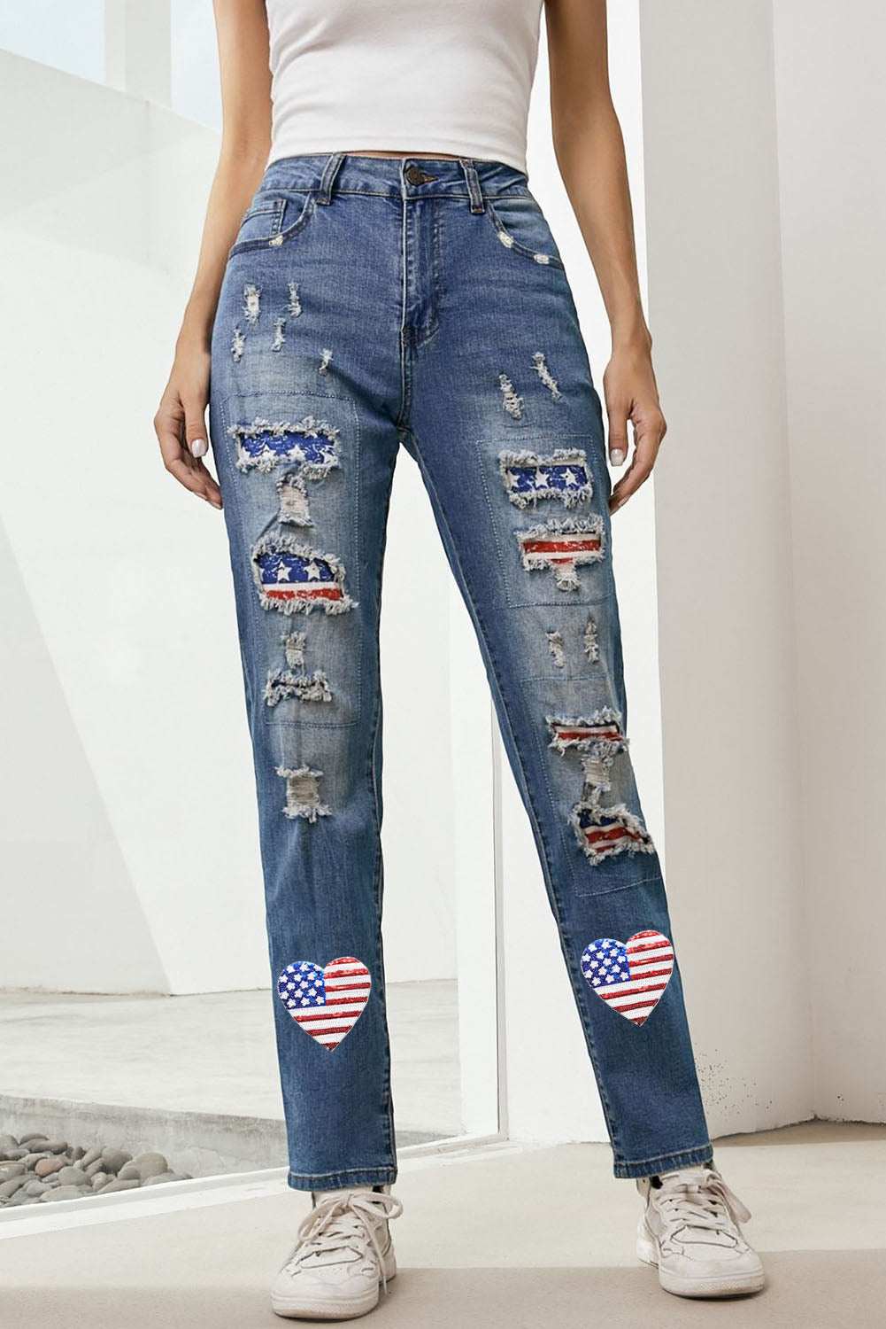 Distressed straight jeans with US flag design and sequin accents.